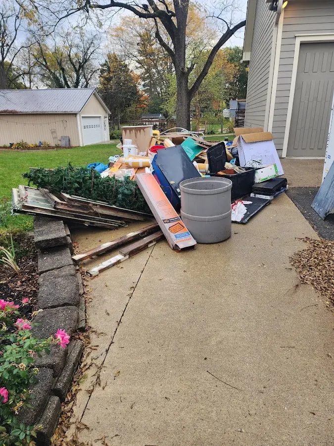 Dumpster being loaded with debris for 3 Yard Dumpster Rental in Watervliet